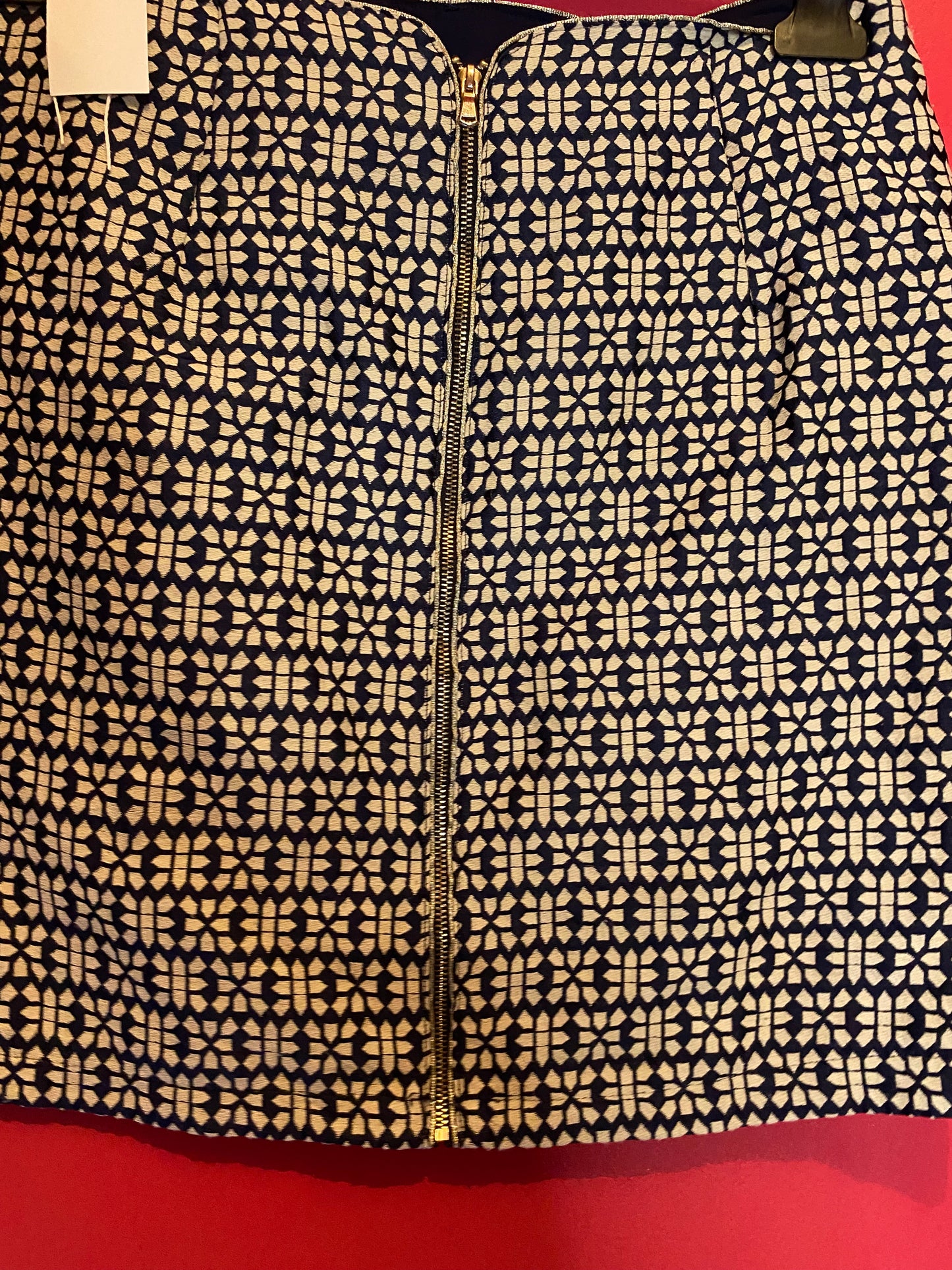 Mini-jupe chic Grain de Malice - Motif géométrique rétro, comme neuve